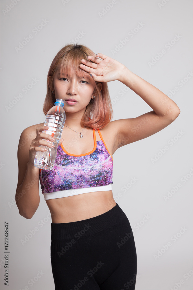 Beautiful Asian healthy girl with bottle of drinking water. Beautiful Asian healthy girl with bottle of drinking water.