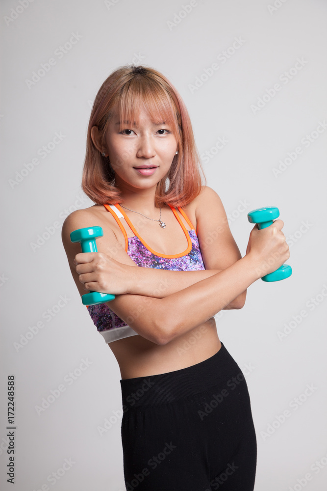 Beautiful Asian healthy girl exercise with dumbbell. Beautiful Asian healthy girl exercise with dumbbell.