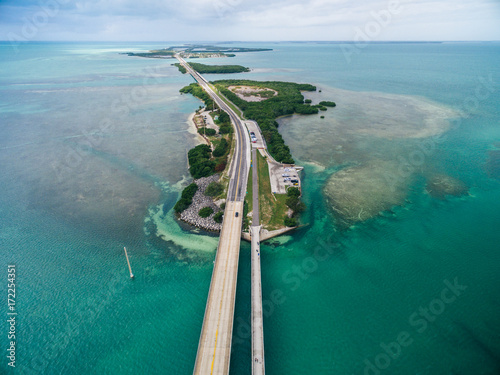 Boat traveling under the Seven Mile Bridge, Florida Keys, USA