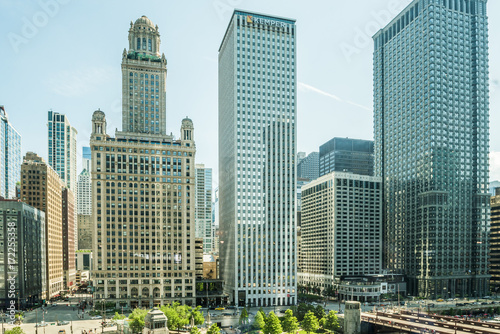 View of Wacker Drive with bridge, skyscrapers, people and cars in downtown in Chicago photo