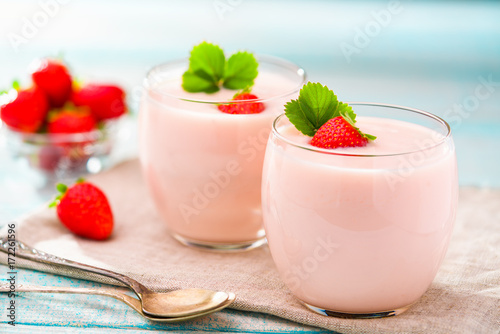 Homemade pink  yogurt with fresh berries strawberries
