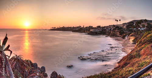 Sunset over the ocean through a neutral density filter at Divers Cove Beach photo