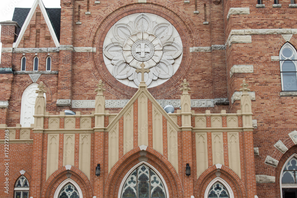 Close up of the facade of St Willebrord Catholic Church in Green Bay, WI - obrazy, fototapety, plakaty 