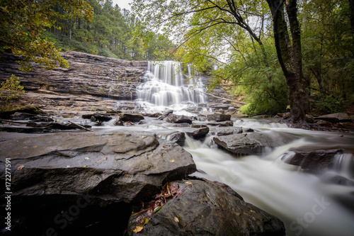 After a heavy rain  the wide water fall narrows into a powerful stream