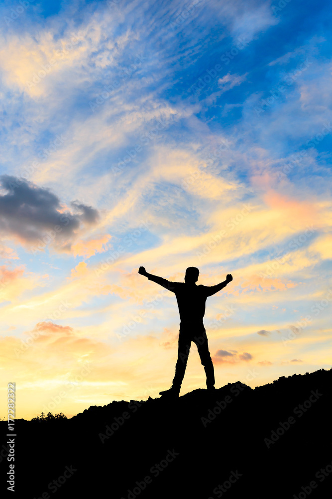 Silhouette of the man success on the peak of mountain,Sport and active life sunset landscape