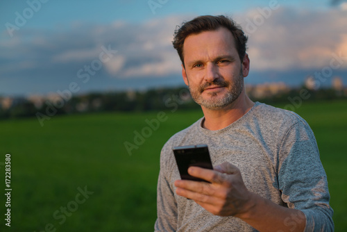 Outdoor Man with mobile portrait photo