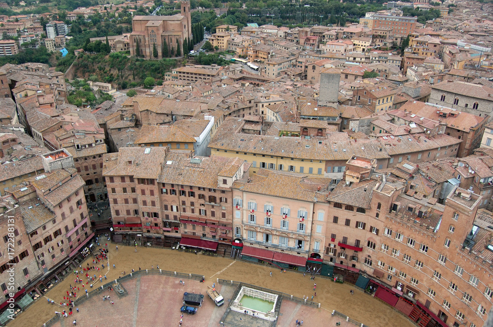 Siena getting ready for the Palio festival, view of the Piazza del Campo from the Mangia tower