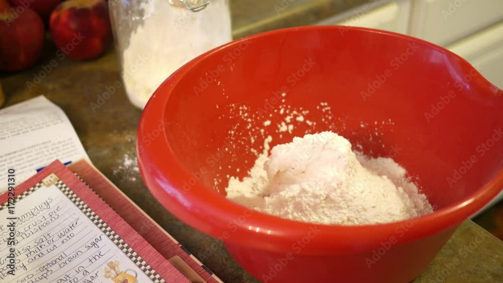 Establishing shot of flour in a food bowl during a baking session Establishing shot of flour in a food bowl during a baking session