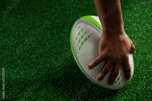 High angle view of sportsman holding rugby ball