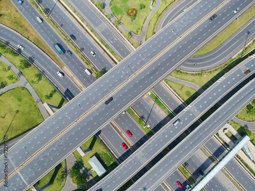 Aerial view traffic road black asphalt with yellow and dashed white stripe and car on nature bird eye view