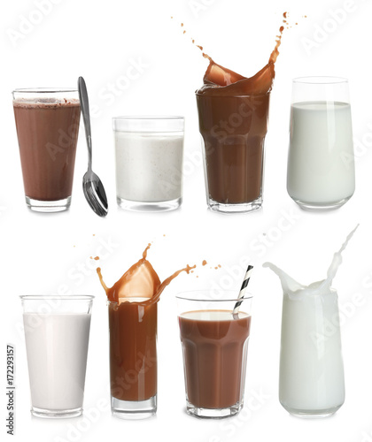 Glasses with different protein shakes on white background