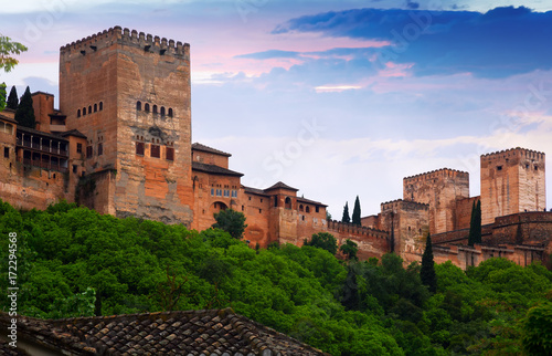 sunrise view of towers of Alcazaba at Alhambra.  Granada