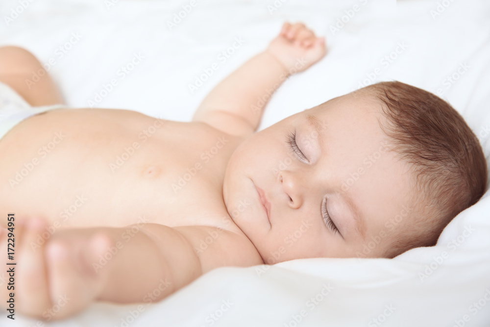 Cute little baby sleeping on bed at home Cute little baby sleeping on bed at home
