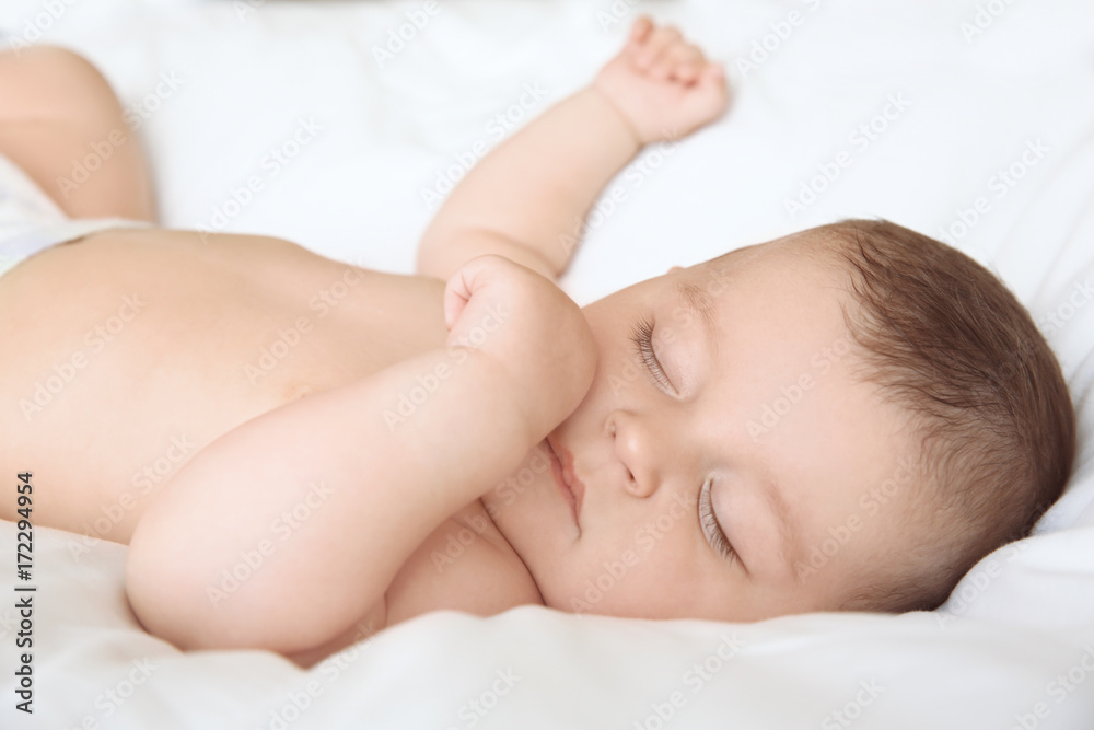 Cute little baby sleeping on bed at home Cute little baby sleeping on bed at home