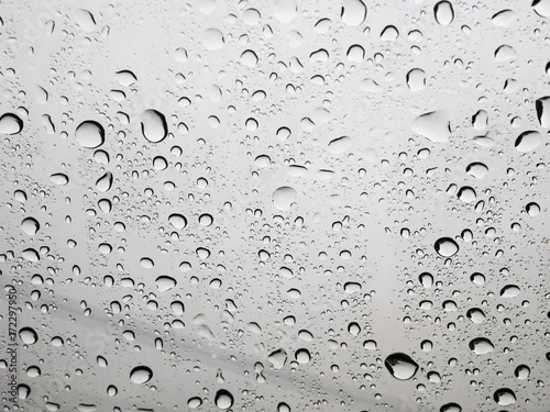 Rain water Drops On gray Background.