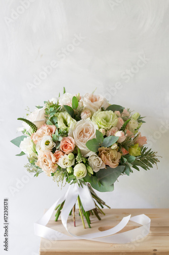 Fototapeta Naklejka Na Ścianę i Meble -  Bridal bouquet. A simple bouquet of flowers and greens
