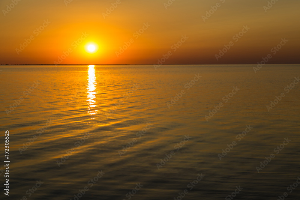 Orange sunset . Siwash lake. Ukraine