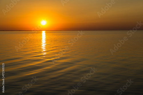 Orange sunset . Siwash lake. Ukraine