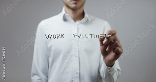 Work fulltime , Man Writing on Glass photo