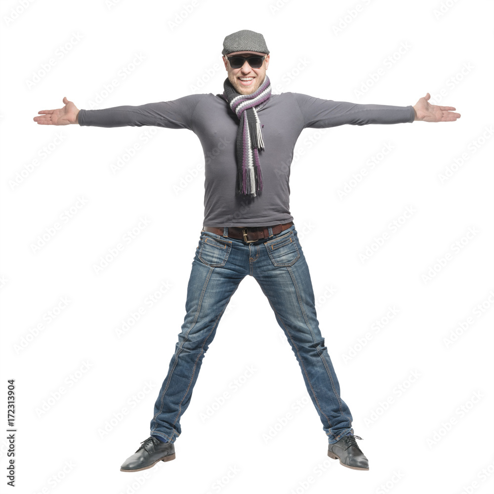 Unshaven bald man wearing a cap, jeans, sunglasses and a scarf is wide open arms. Isolated Unshaven bald man wearing a cap, jeans, sunglasses and a scarf is wide open arms. Isolated