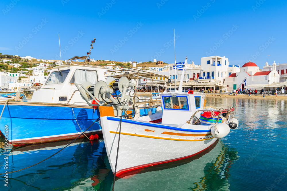 Typical colourful Greek fishing boats in Mykonos town port on island of Mykonos, Cyclades, Greece