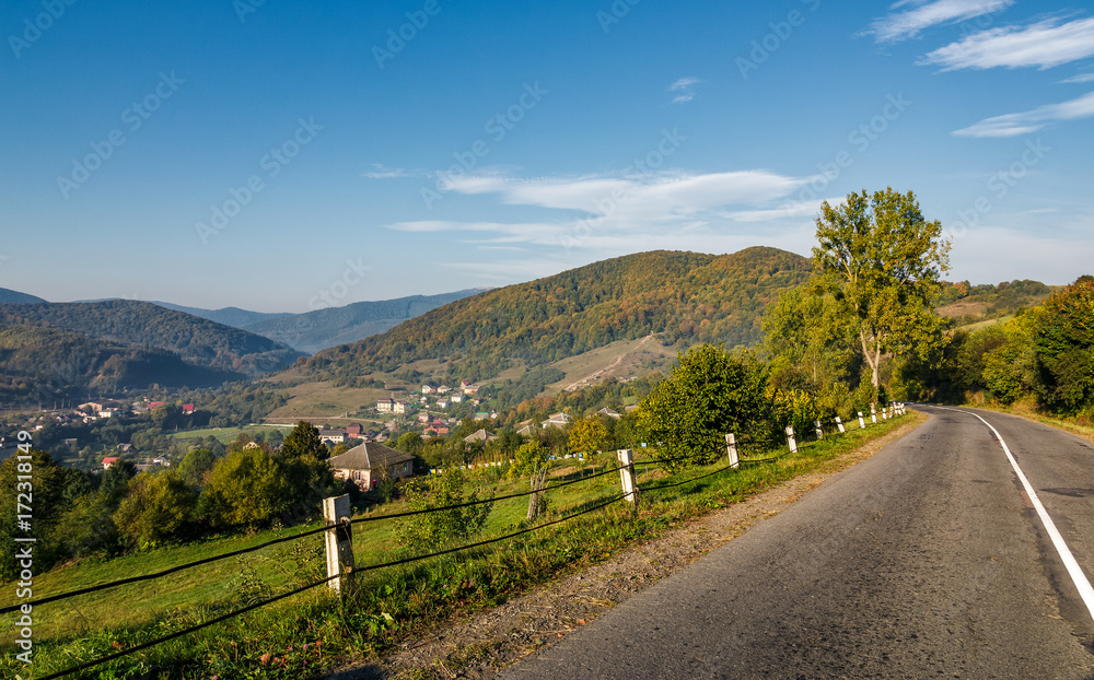 asphalt road in mountainous countryside. beautiful early autumn morning scenery asphalt road in mountainous countryside. beautiful early autumn morning scenery