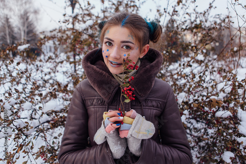 Winter portrait of a girl with stars on face
