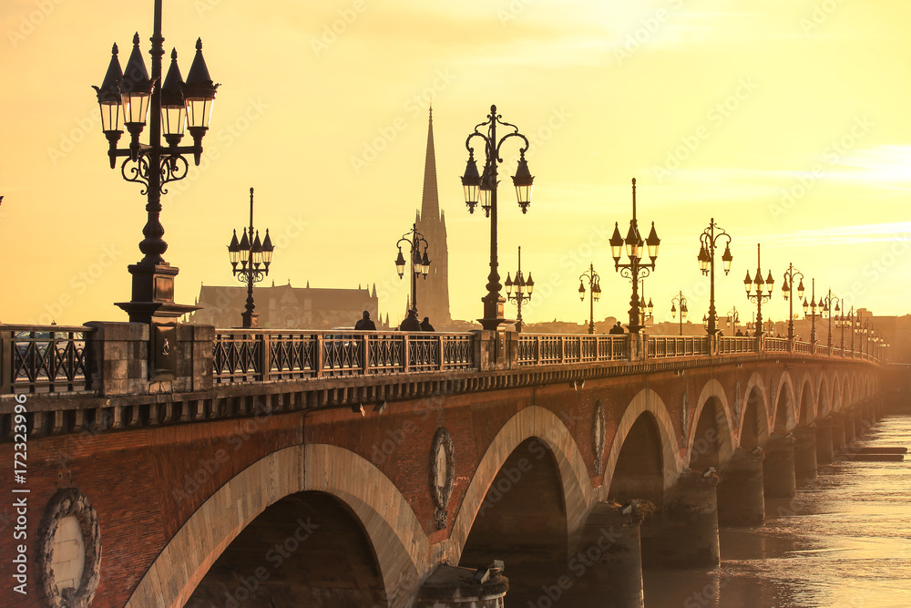 Pont de Pierre bridge in Bordeaux at sunset