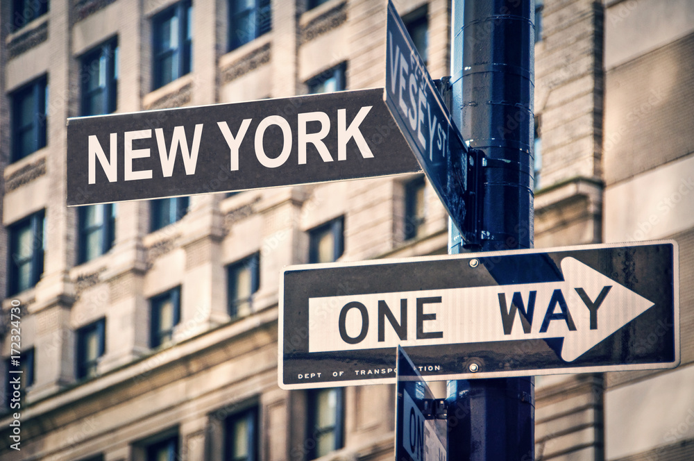 Close up on New York and One way written on a direction roadsign, in New York City,  USA