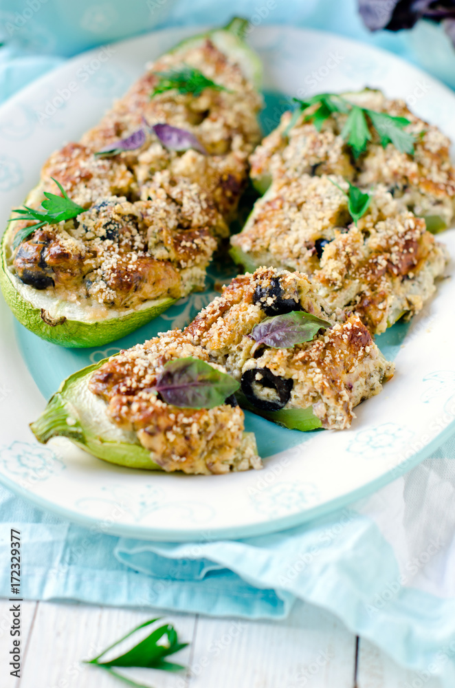 Baked zucchini stuffed with cheese and black olives Baked zucchini stuffed with cheese and black olives