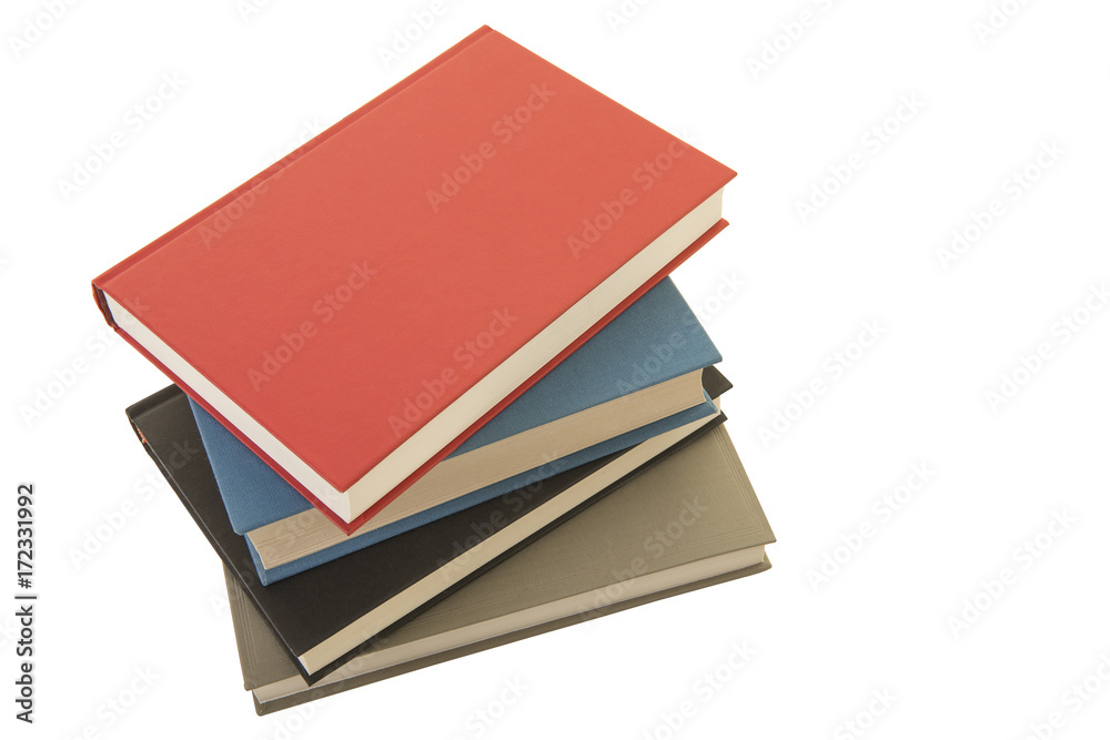 Staple of four books seen from an high angle view isolated on a white background Staple of four books seen from an high angle view isolated on a white background