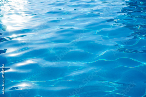 Water in swimming pool, rippled water background, texture