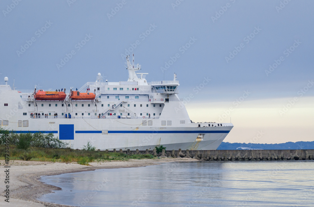 PASSENGER-CAR FERRY - ship sails into the sea from seaport