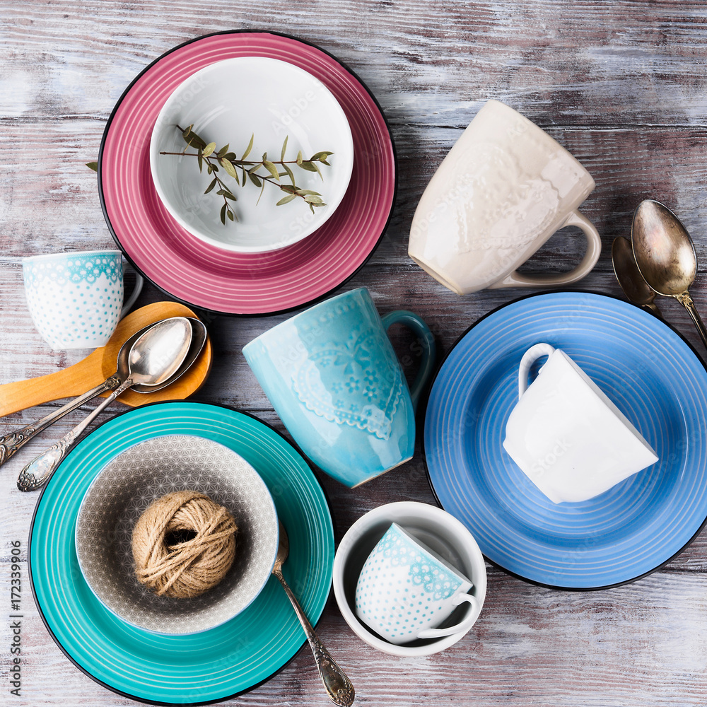Ceramic crockery tableware on wooden background. Pastel vintage