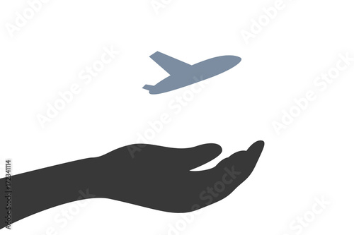 Hand hält Flugzeug