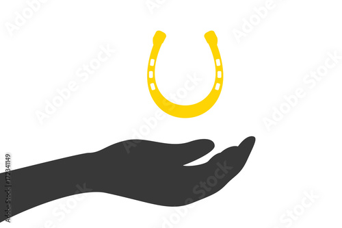 Hand hält Hufeisen