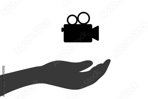 Hand hält Videokamera