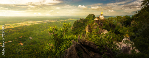 Panoramic shot : Wat Chalermprakiat Prajomklao Rachanusorn chedis on the mountain top, Lampang province, Thailand photo