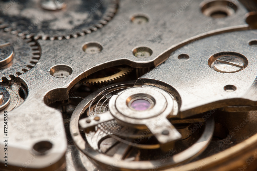 Detail of watch machinery on the table. Detail of watch machinery on the table.