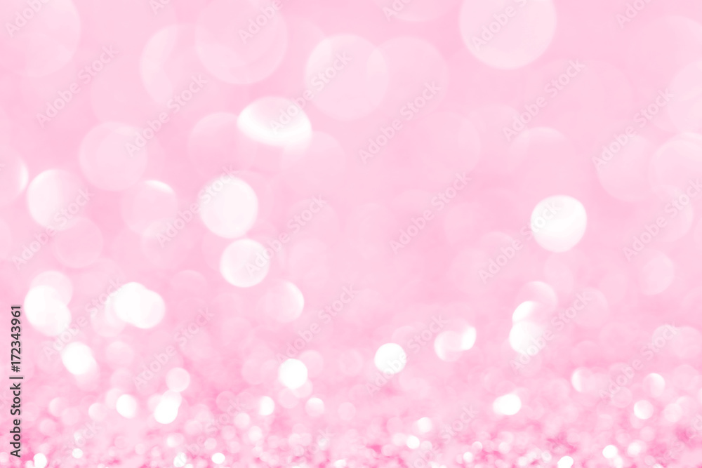 Pink glittering Christmas lights. Blurred abstract background