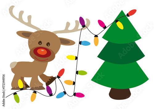 Fototapeta Naklejka Na Ścianę i Meble -  Happy reindeer decorates a Christmas tree with lighting color cain