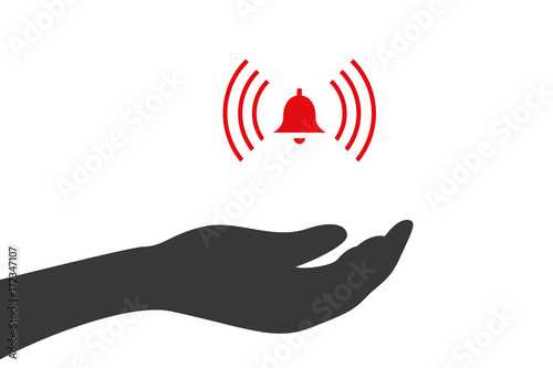 Hand hält Glocke