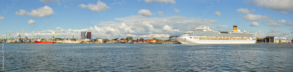 Klaipeda, Lithuania - August 20, 2017: Beautiful view on Klaipeda and Curonian Lagoon from The Curonian Spit, Lithuania. Beautiful summer panorama on Klaipeda, Curonian Lagoon and big cruise ship.