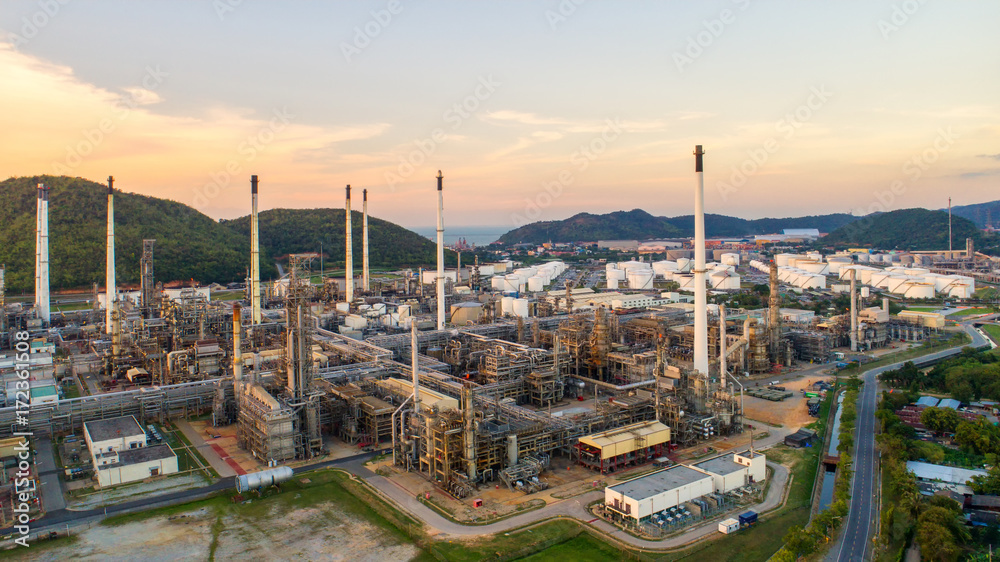 Aerial view Oil refinery.Industrial view at oil refinery plant form industry zone with sunrise and cloudy sky.Oil refinery and Petrochemical plant at dusk,Thailand.