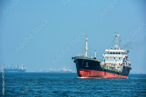 oil tanker, gas tanker in the high sea.Refinery Industry cargo ship,aerial view,Thailand, in import export, LPG,oil refinery, Logistics and transportation with working crane bridge in harbor © MAGNIFIER