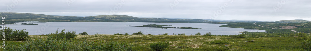 Panoramic view of the lake in the tundra of the Kola Peninsula. The Arctic, Russia.