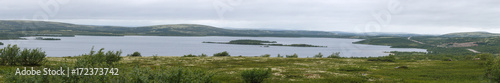 Panoramic view of the lake in the tundra of the Kola Peninsula. The Arctic, Russia.