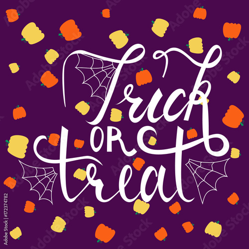Trick or treat modern brush inscription. Illustrated phrase for Halloween on background with pumpkins