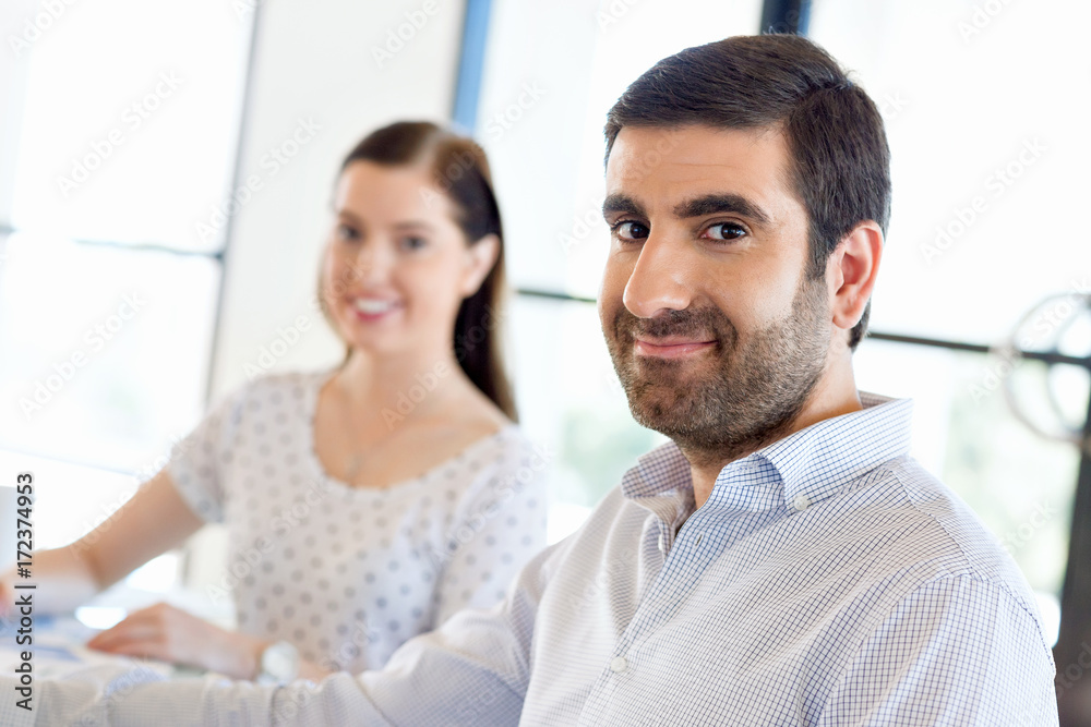 Image of two young business people in office Image of two young business people in office