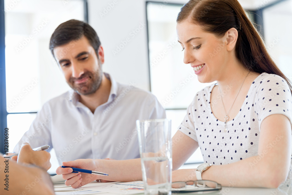 Image of two young business people in office Image of two young business people in office